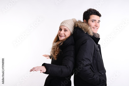Fototapeta Naklejka Na Ścianę i Meble -  isolated studio portrait of young couple in winter outfit