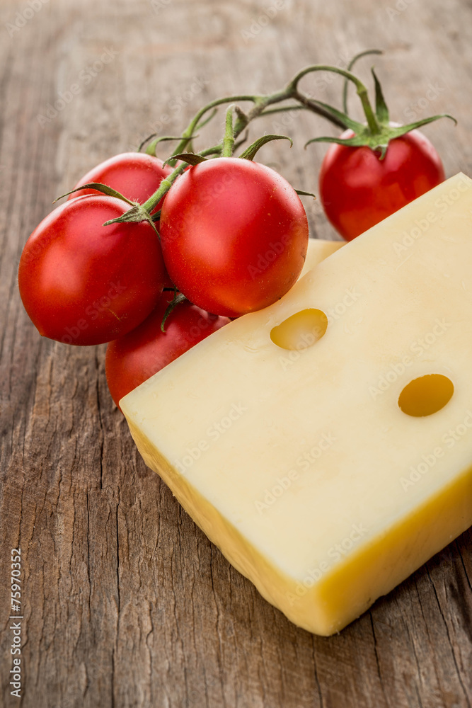 Piece cheese and cherry tomatoes Piece cheese and cherry tomatoes