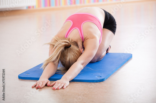 Young woman doing yoga exercise