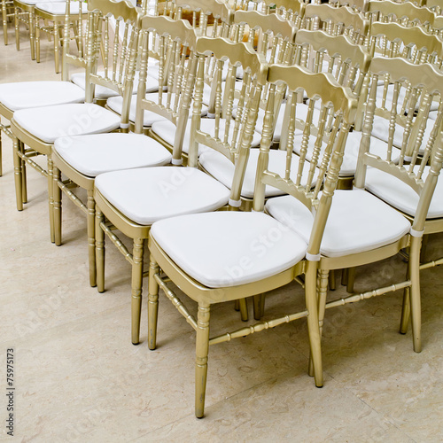 Rows of gold chairs - meeting background