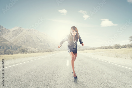 Running businesswoman © Sergey Nivens