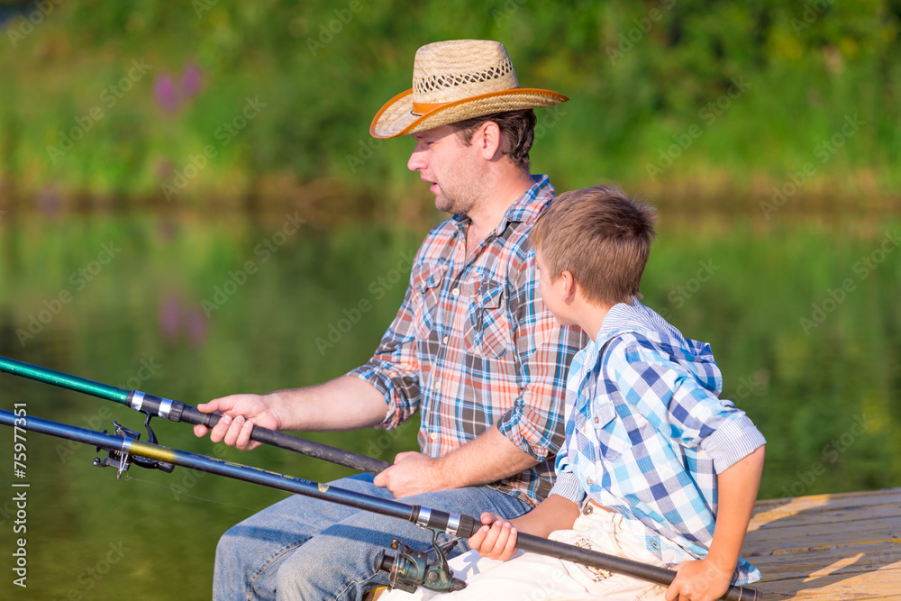 boy and his father fishing togethe boy and his father fishing togethe