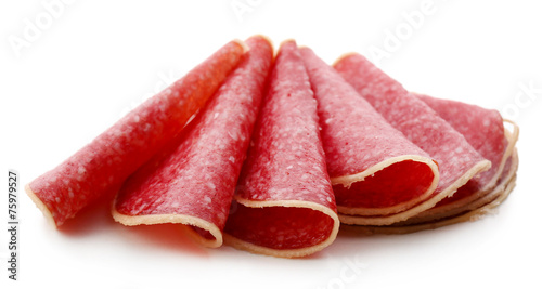 Slices of salami isolated on white background