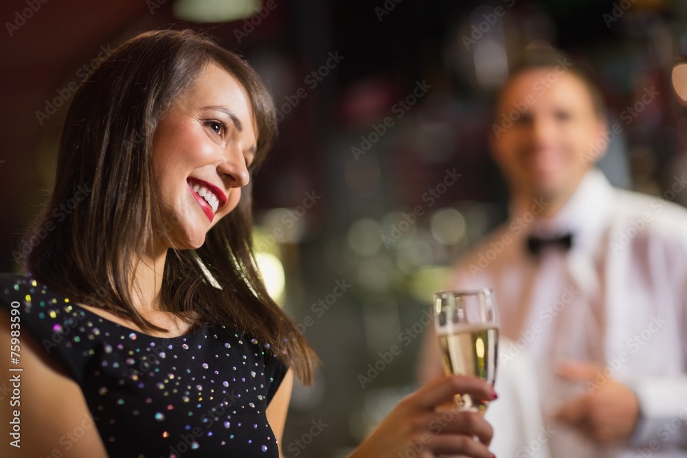 Pretty brunette smiling with champagne Pretty brunette smiling with champagne