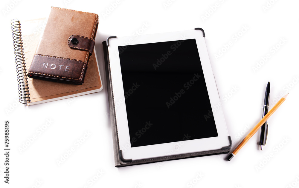 Tablet PC with notebook on wooden table background Tablet PC with notebook on wooden table background