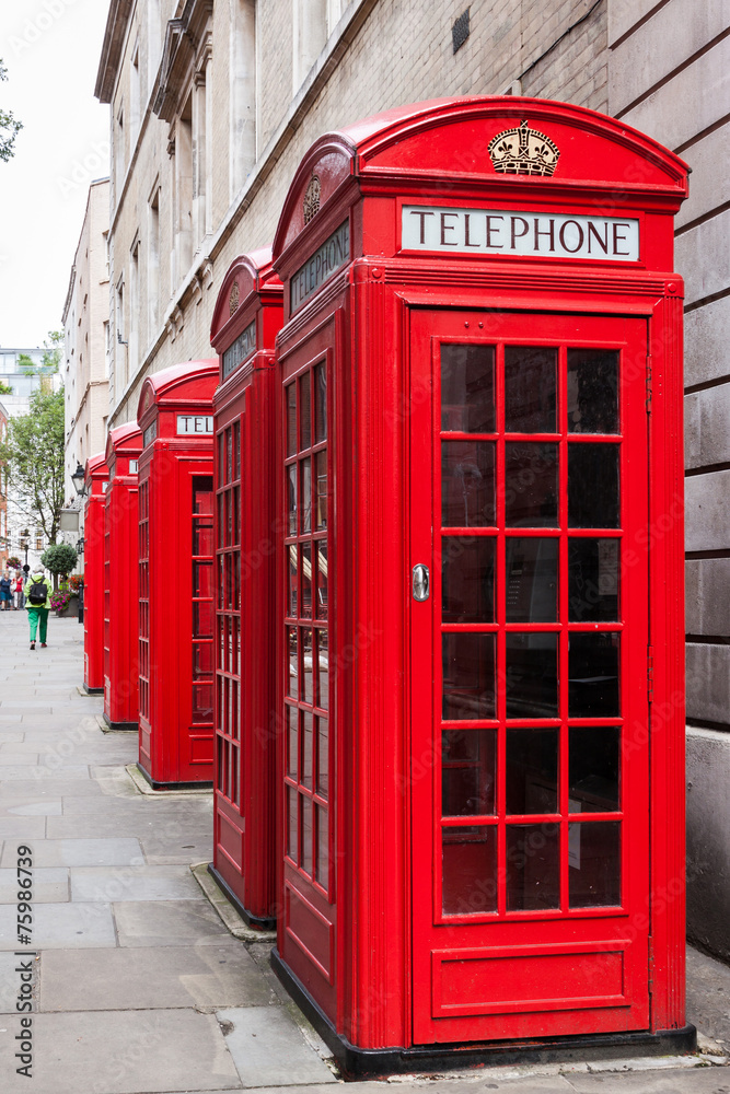 Traditional red telephone booths in London Traditional red telephone booths in London