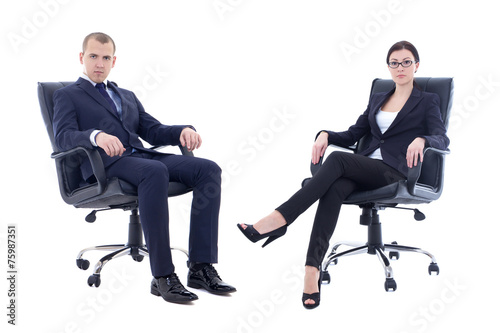 young man and beautiful woman in business suits sitting on offic photo
