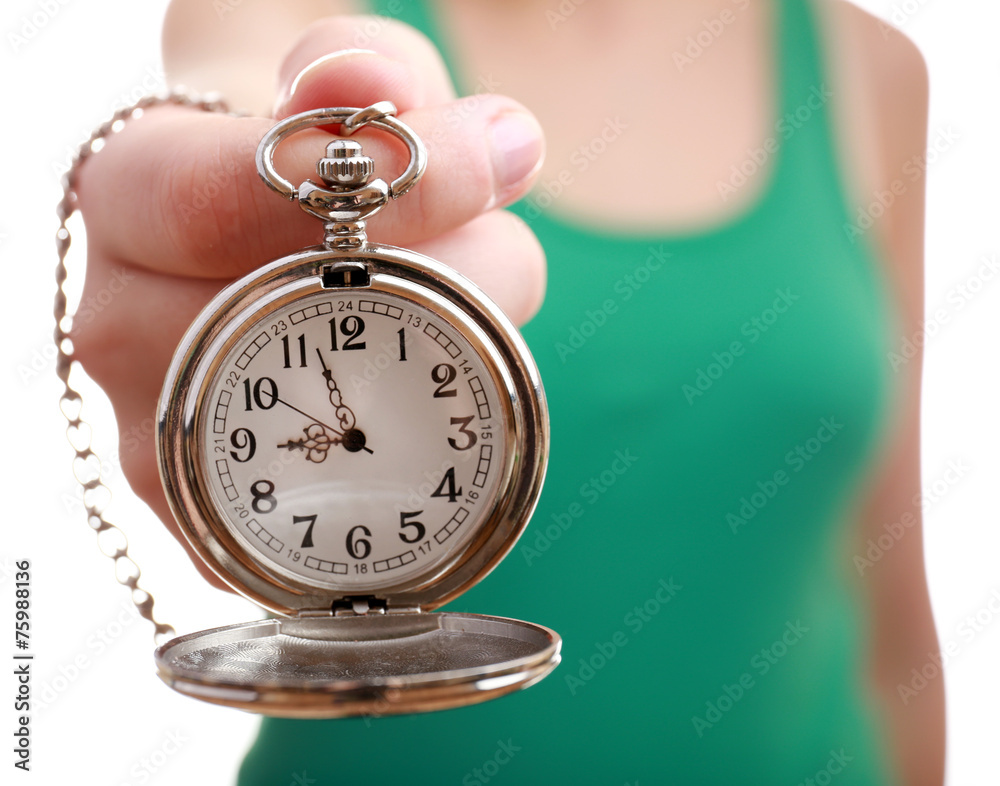 Silver pocket clock in hand close-up Silver pocket clock in hand close-up