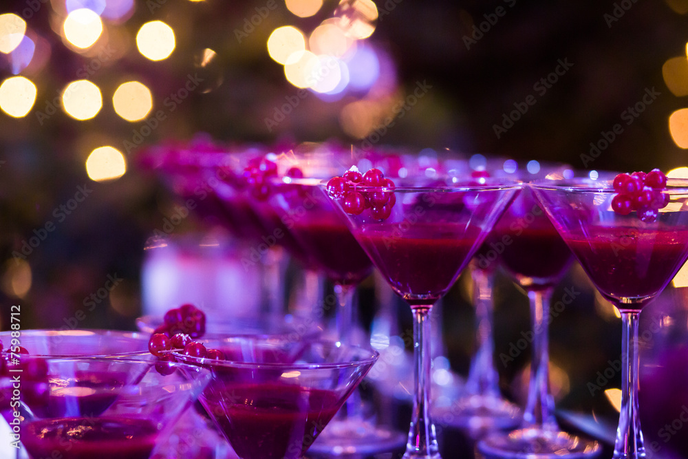 Line of different colored cocktails with smoke on a party Line of different colored cocktails with smoke on a party