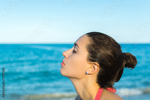 Woman relaxing at the sea