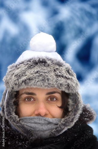Young woman with snowball on her head