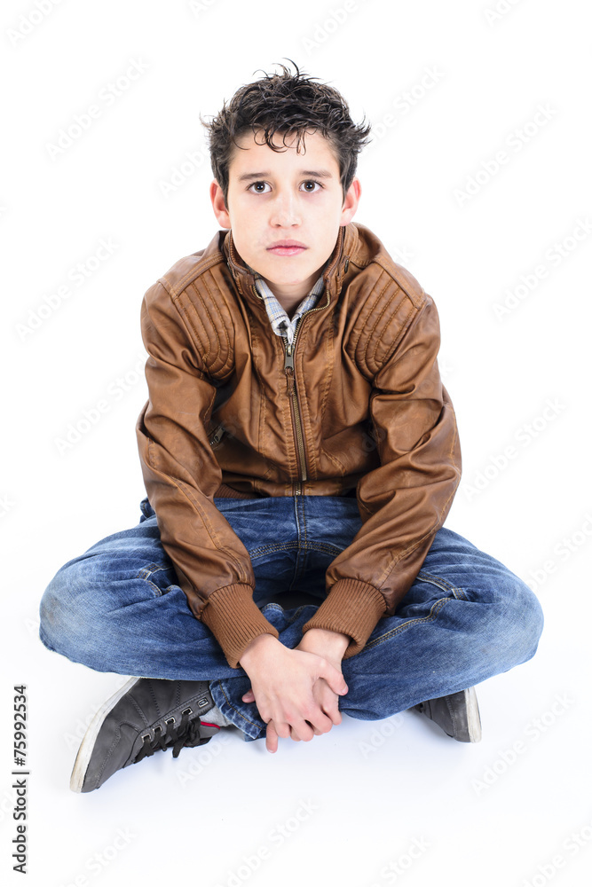 Portrait of a handsome boy sitting cross-legged Portrait of a handsome boy sitting cross-legged