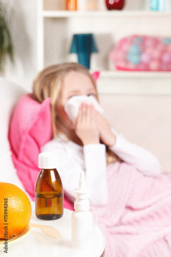 Sick little girl blowing her nose Sick little girl blowing her nose