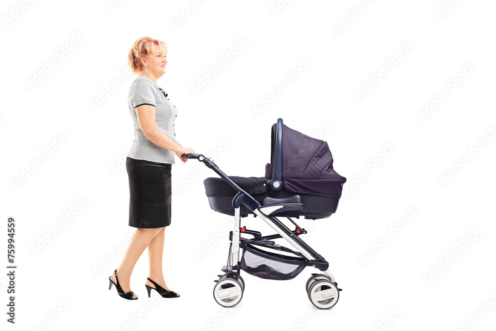 Mature woman pushing a baby stroller Mature woman pushing a baby stroller