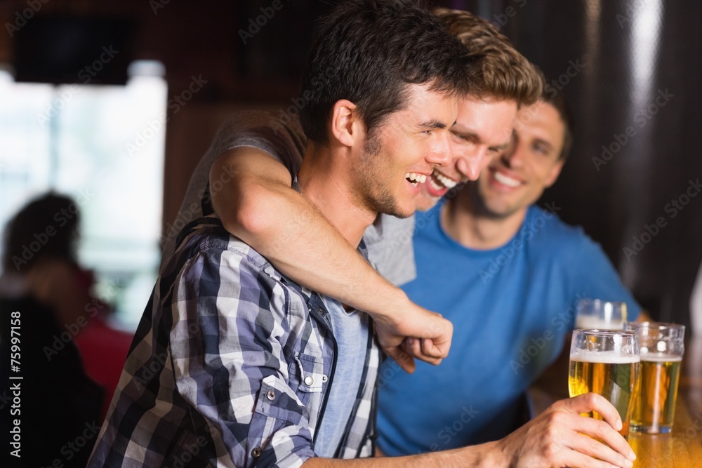 Happy friends catching up over pints