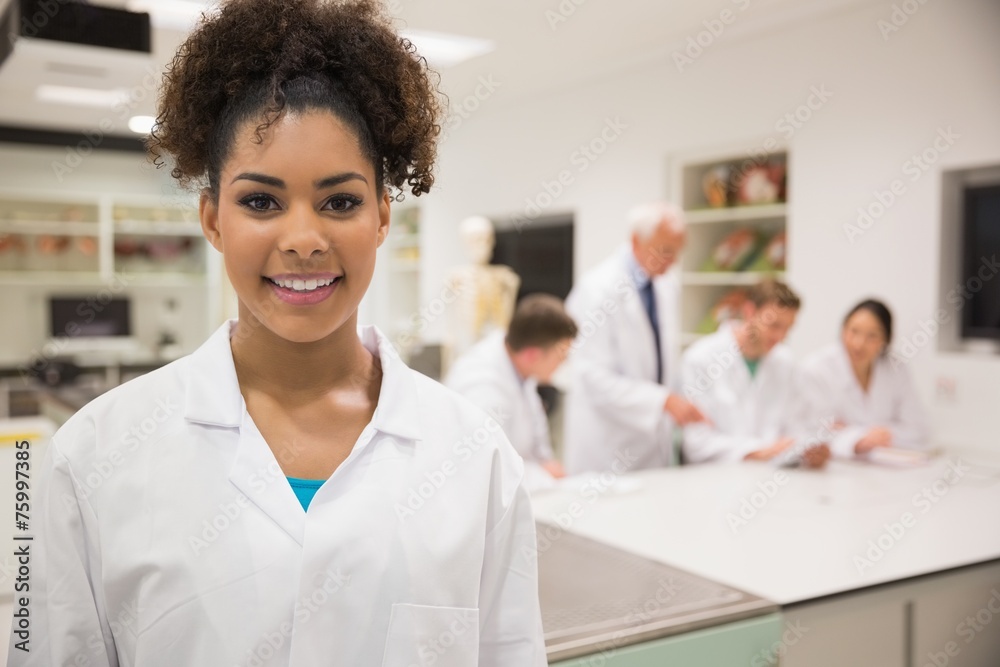 Pretty science student smiling at camera Pretty science student smiling at camera