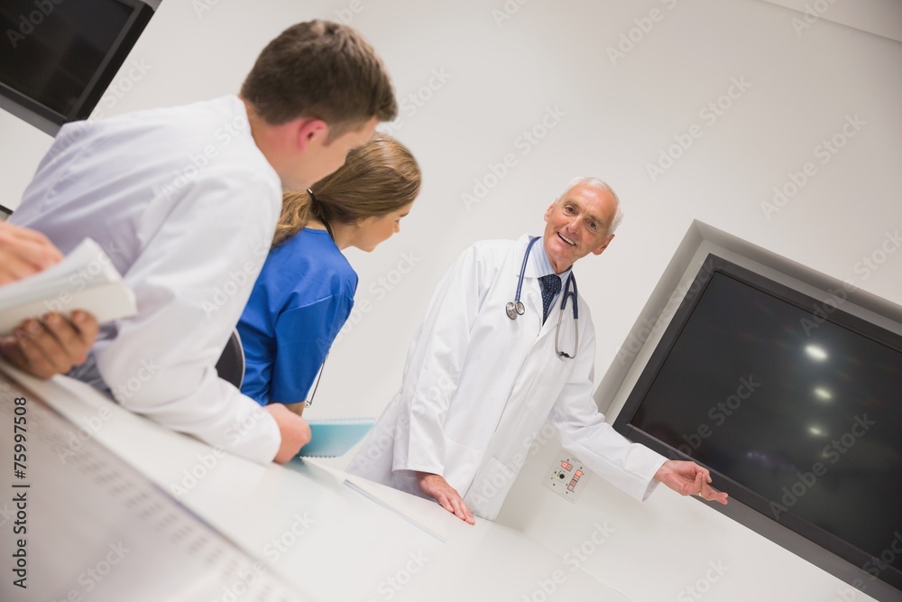 Medical professor teaching young students