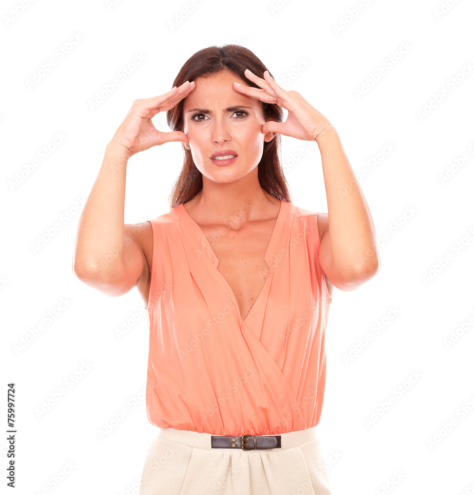 Hispanic female suffering from migraine headache Hispanic female suffering from migraine headache