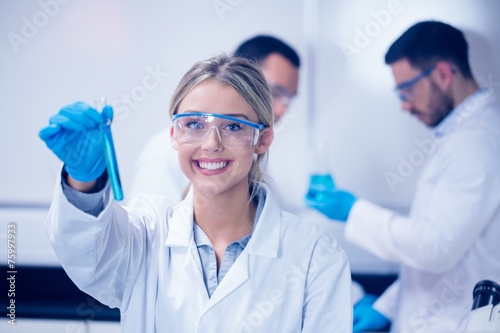 Science student holding up test tube