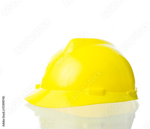 Hard yellow hat for industrial work, engineers, architect isolat