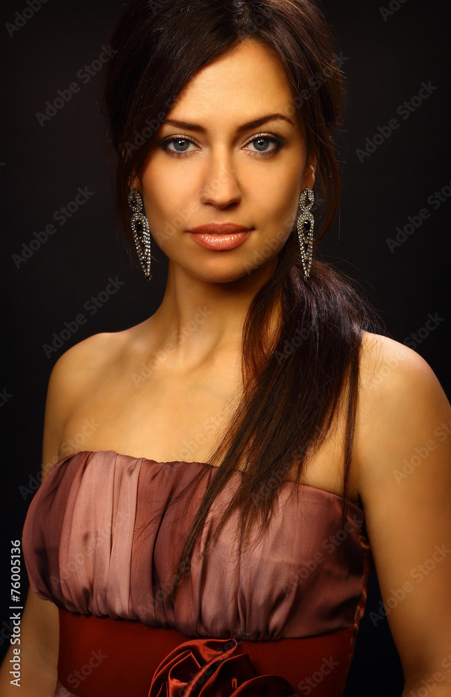Beautiful young woman portrait. Jewelry and diamonds