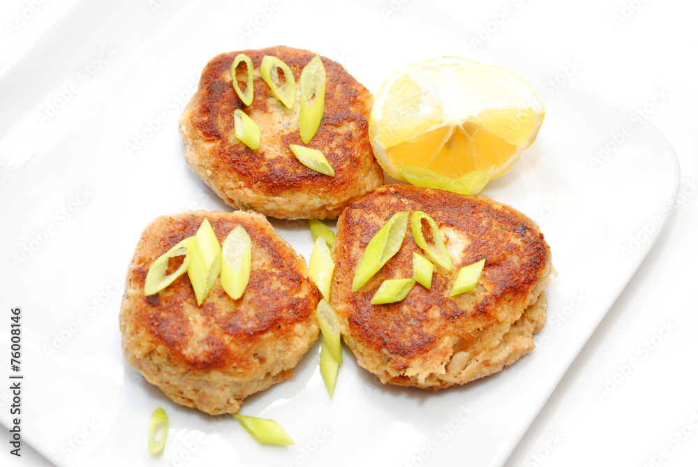 Fish Cakes Served with Lemon and Scallions