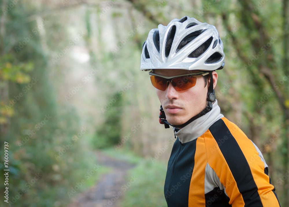 Cyclist portrait in the forest Cyclist portrait in the forest