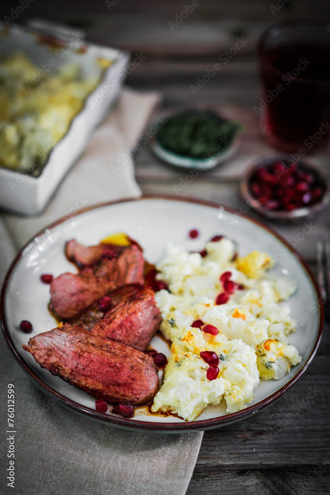 Grilled steak with cauliflower and pomegranate