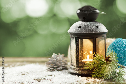 Vintage lantern with seasonal winter decoration © George Dolgikh