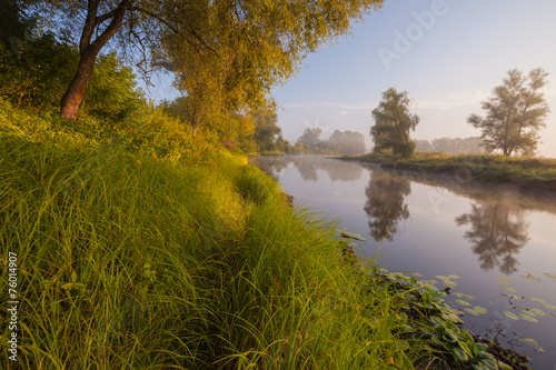 Fototapeta Naklejka Na Ścianę i Meble -  Beautiful summer water landscape in sunbeam