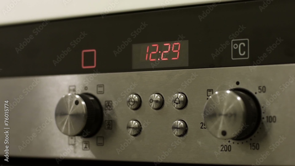 Electronic clock work on the oven in the kitchen Electronic clock work on the oven in the kitchen