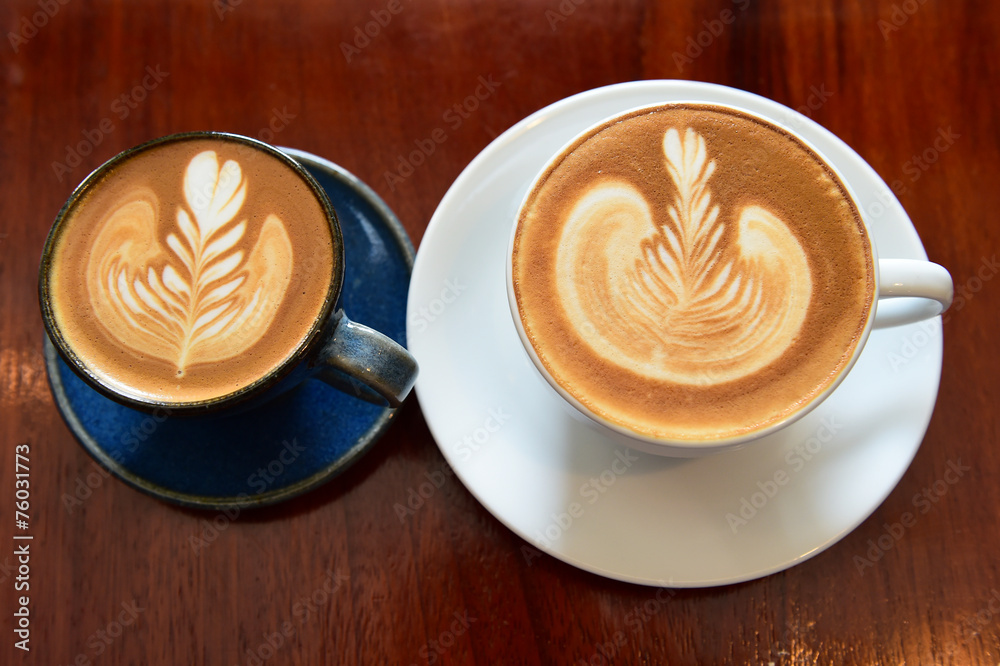 cup of latte art coffee on wooden background cup of latte art coffee on wooden background