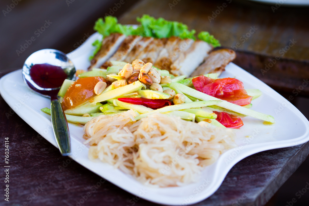 Spicy mango salad with vegetable and nooddle and grilled pork Spicy mango salad with vegetable and nooddle and grilled pork