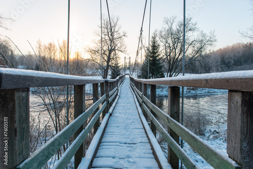 snowy winter forest landscape with bridge © Martins Vanags