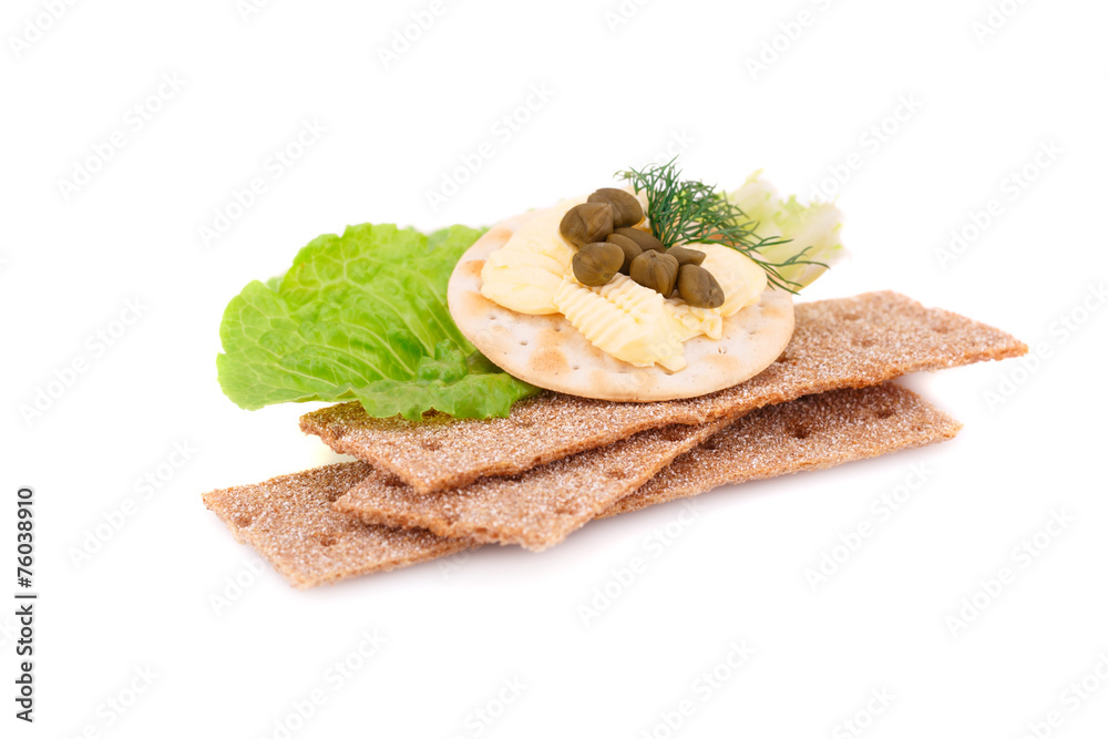 Crackers with fresh vegetables and butter Crackers with fresh vegetables and butter