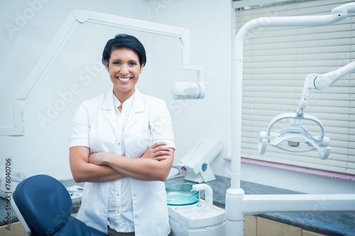 Female dentist with arms crossed