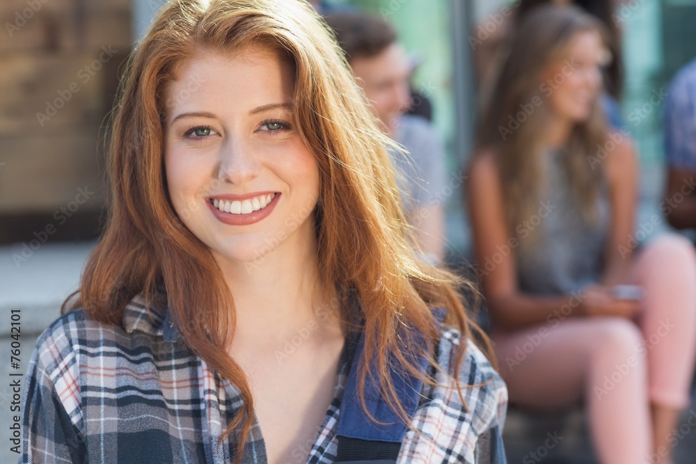 Pretty student smiling at camera outside Pretty student smiling at camera outside
