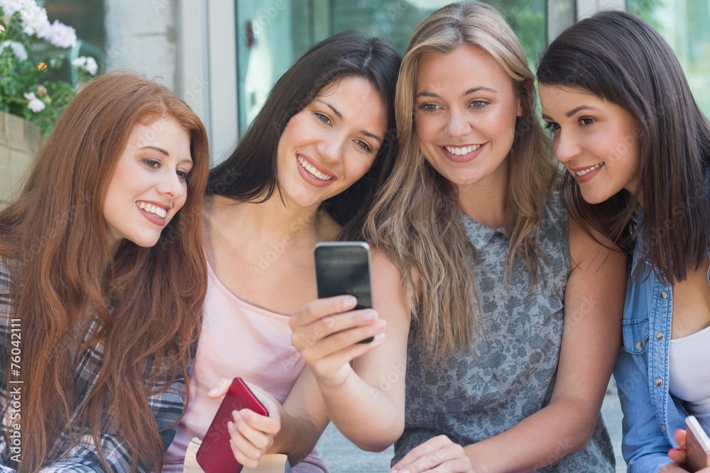 © WavebreakmediaMicro - Happy students sitting in a row texting © WavebreakmediaMicro - Happy students sitting in a row texting
