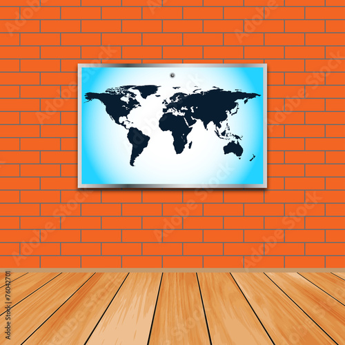 Brick wall with a map in a frame and wooden floor