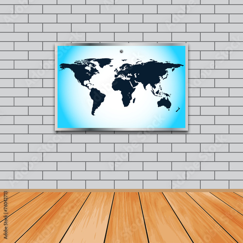 Against the background of a brick wall map of the world