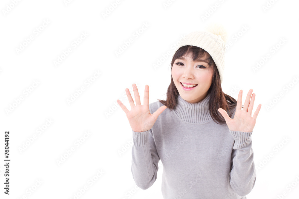 happy, smiling, joyful woman wearing knit hat, showing her palm happy, smiling, joyful woman wearing knit hat, showing her palm