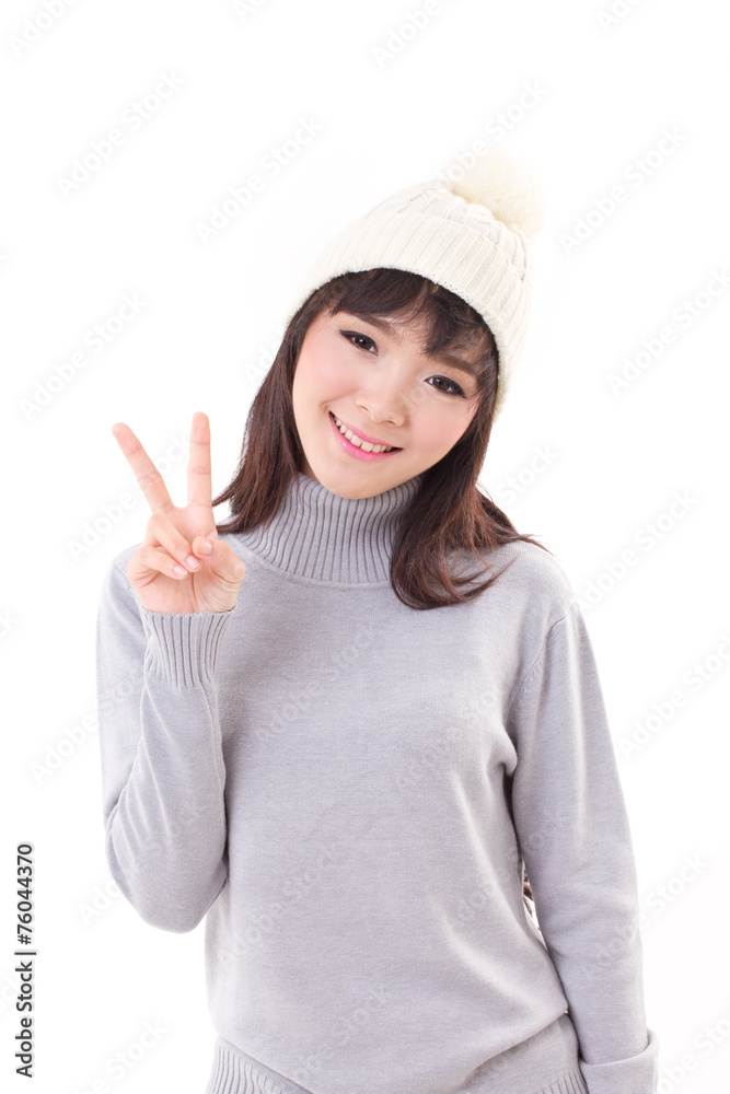 happy, smiling, joyful woman wearing knit hat, showing 2 fingers happy, smiling, joyful woman wearing knit hat, showing 2 fingers