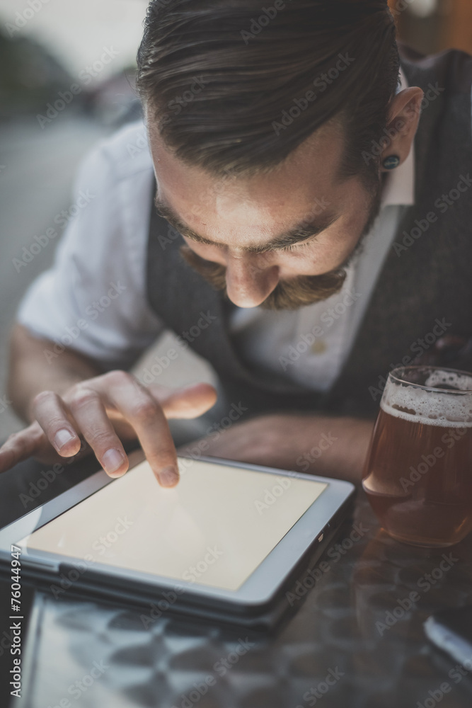 handsome big moustache hipster man using tablet handsome big moustache hipster man using tablet