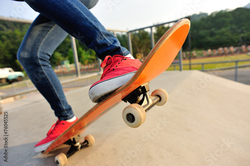 skateboarding legs at skatepark