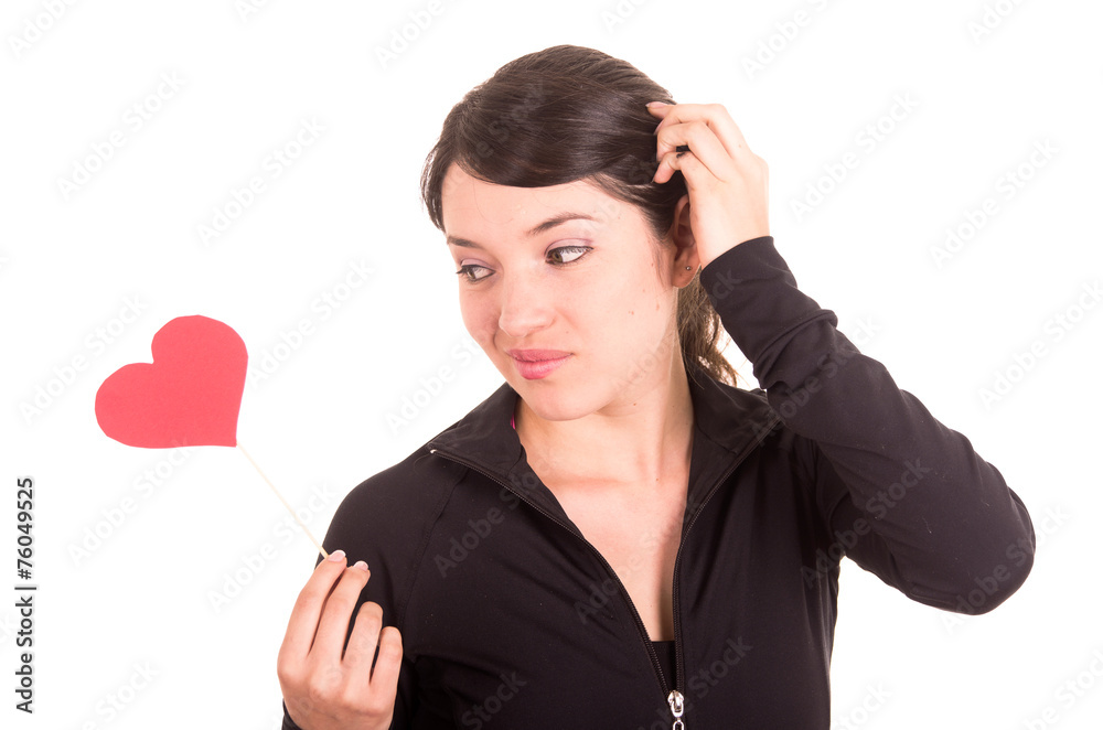 beautiful young latin confused girl holding red paper heart beautiful young latin confused girl holding red paper heart