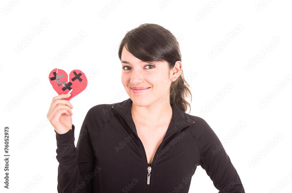 cute young smiling latin girl holding mended heart cute young smiling latin girl holding mended heart