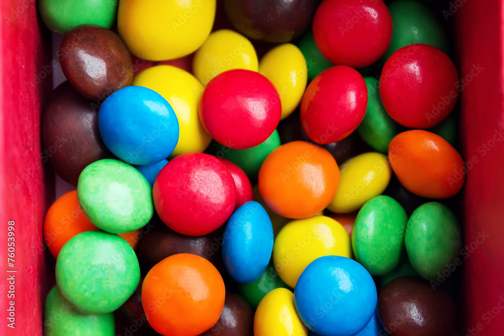 Close up of a pile of colorful chocolate coated candy Close up of a pile of colorful chocolate coated candy