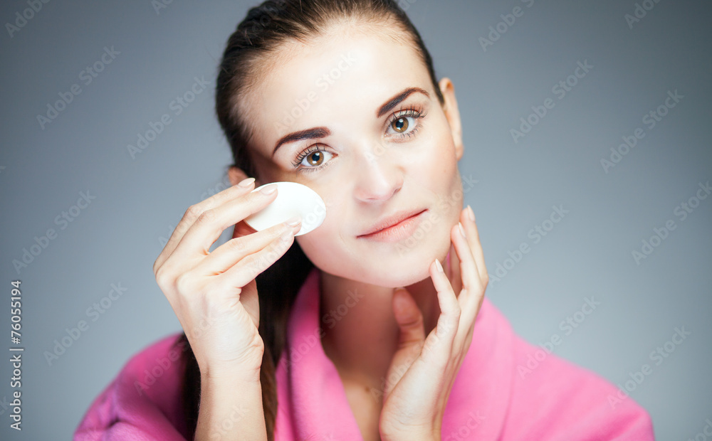 Fresh girl cleaning face with cotton swab Fresh girl cleaning face with cotton swab