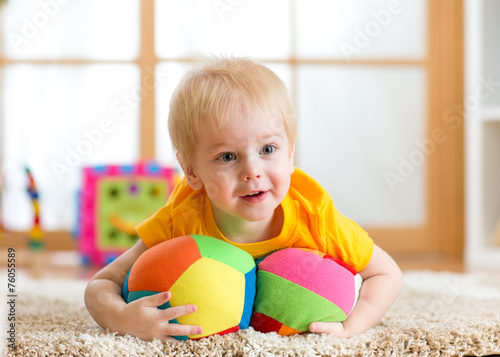 toddler boy playing with to...