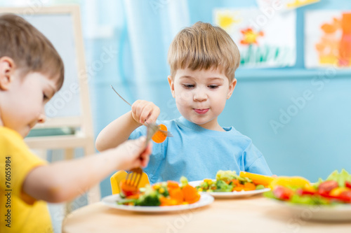 children eating in kindergarten
